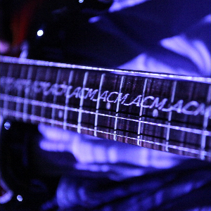 Wobble Strings: Spatially Divided Stroboscopic Effect for Augmenting Wobbly Motion of Stringed Instruments